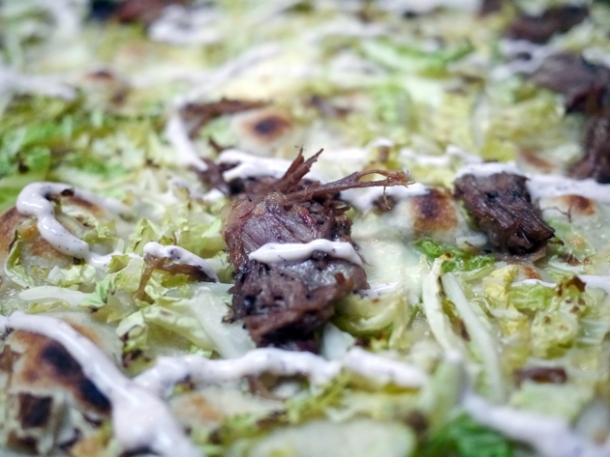 goat shoulder, cabbage and yoghurt pizza at homeslice fitzrovia